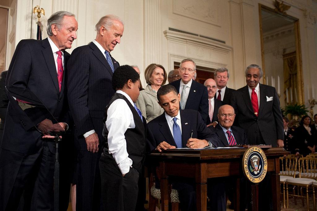Barack Obama signing a bill
