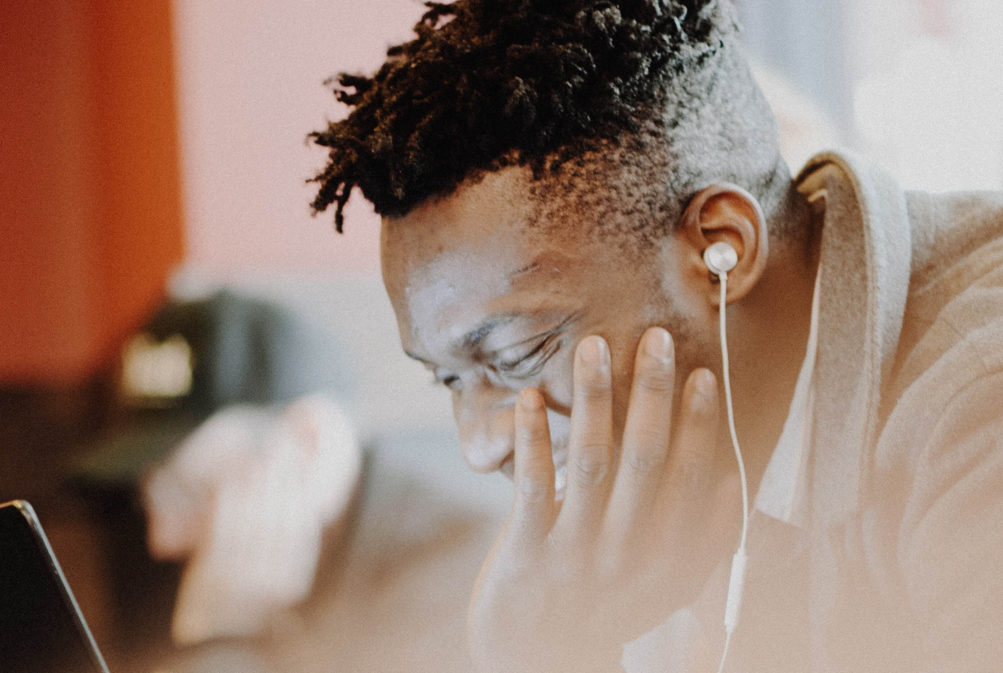 man listening to earphones