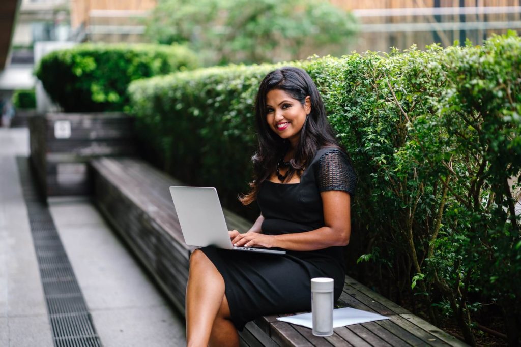 woman working outside on laptop