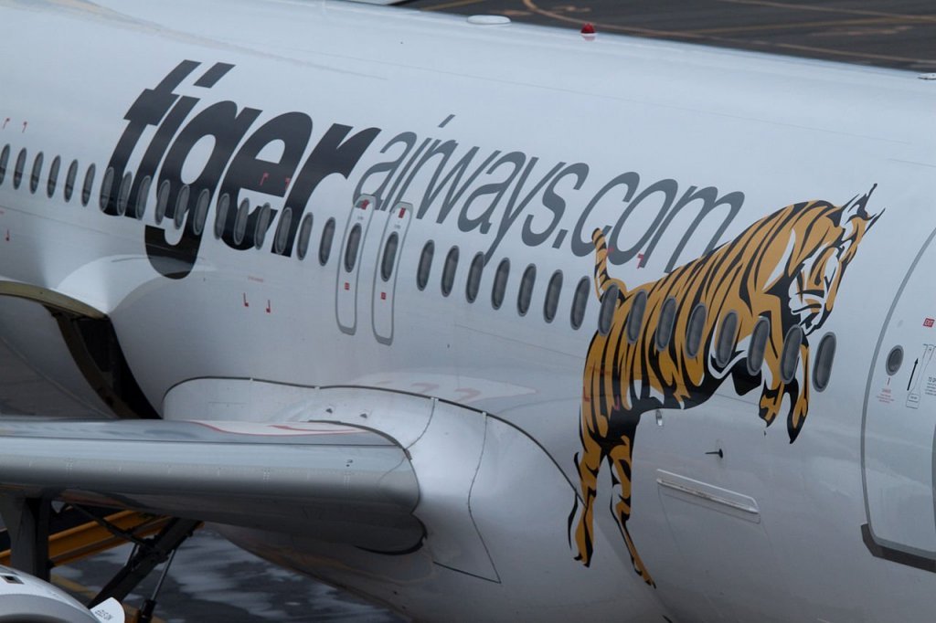 Tiger Airways logo on aircraft standing-only flight