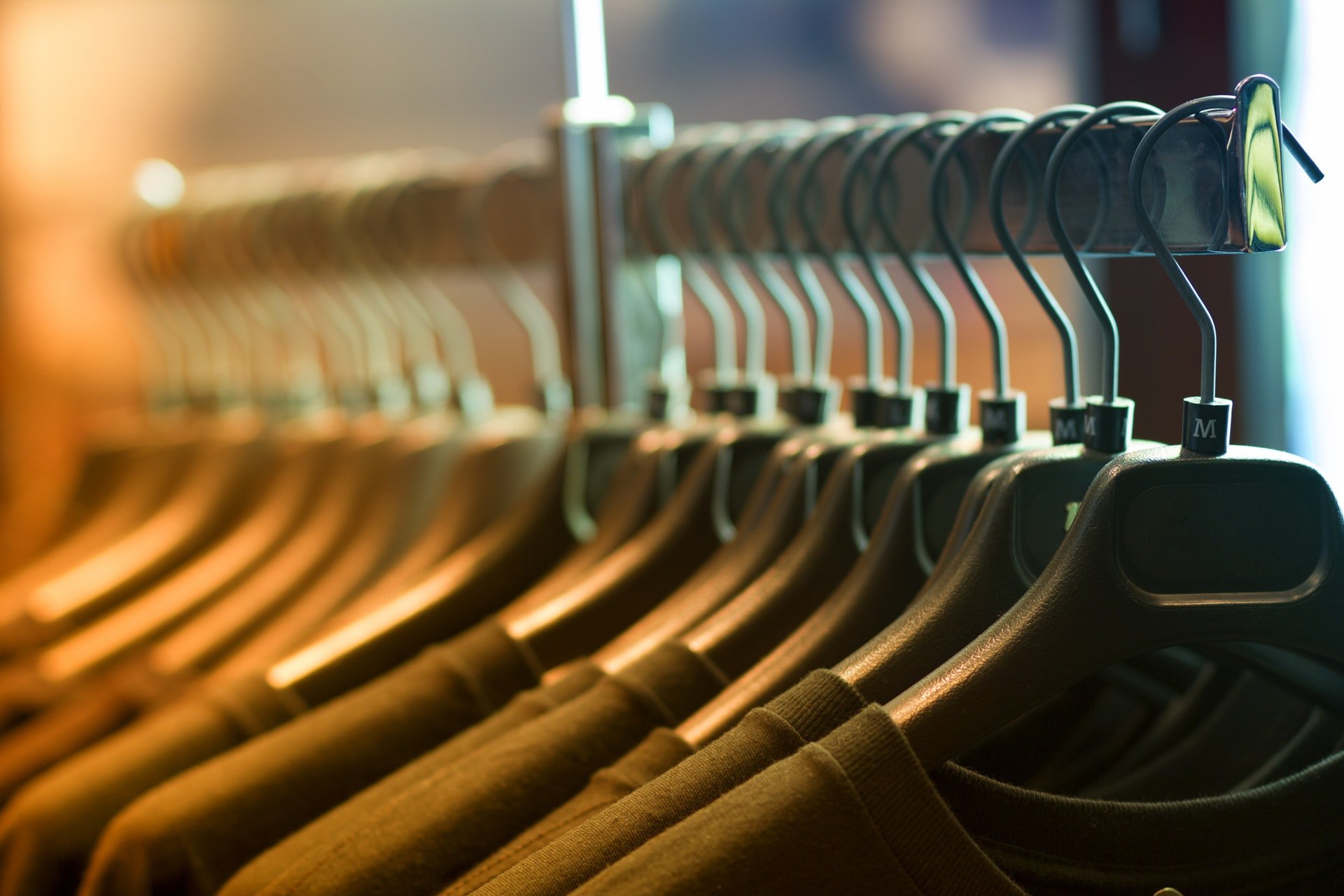 T-shirts hanging in shirt rack