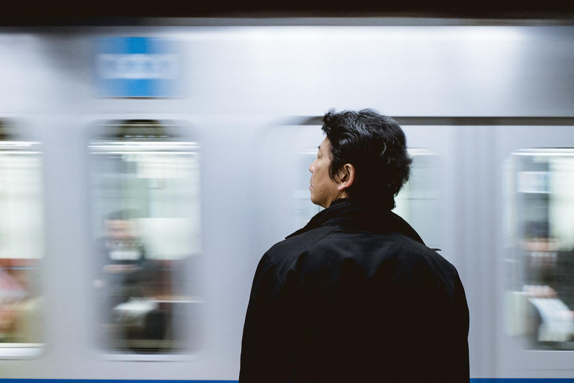 Man in front of train