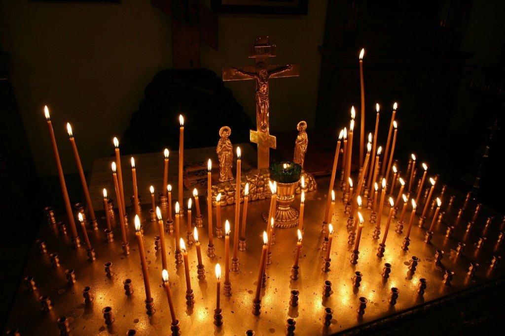 Belief - Crucifix surrounded by candles