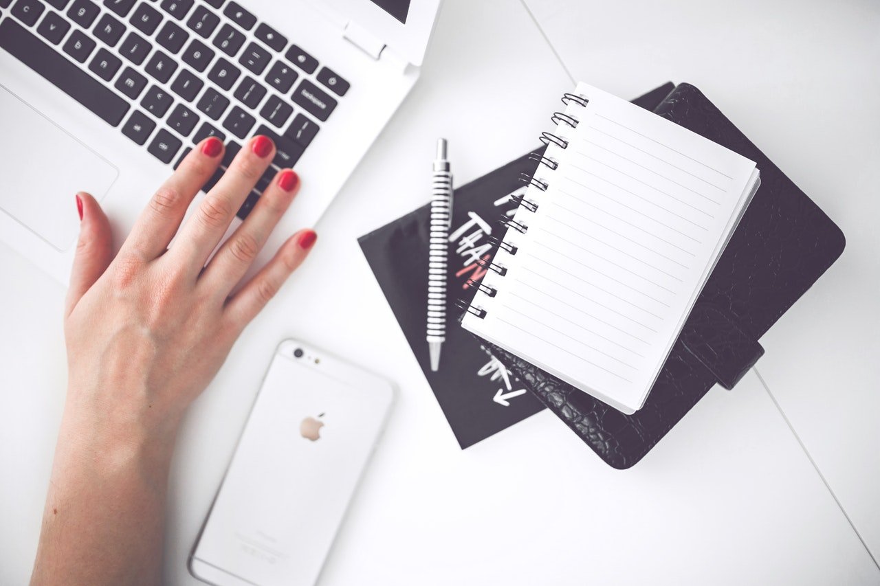 woman's hand on laptop