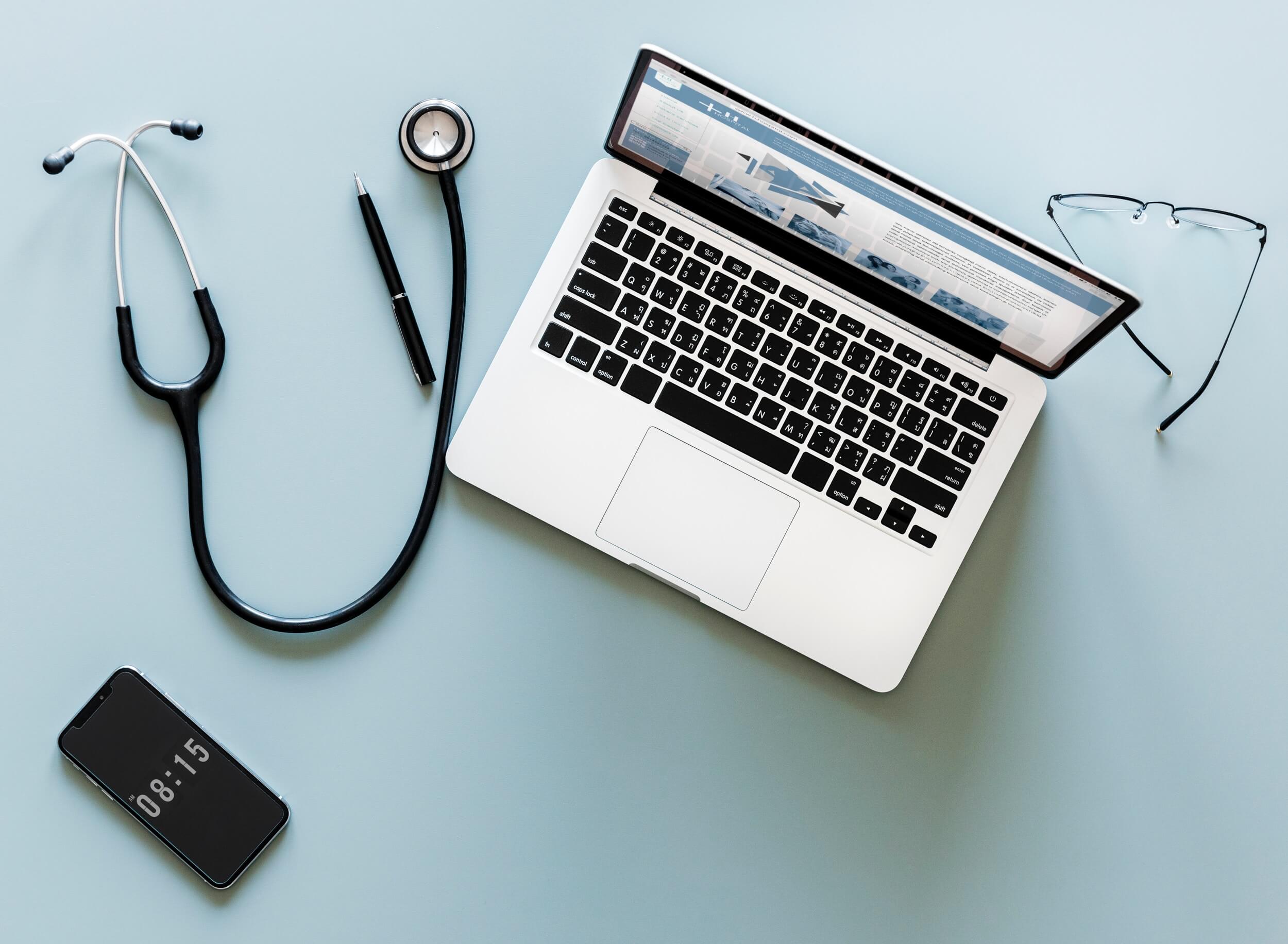 laptop flatlay stethoscope