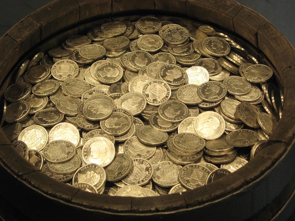 This picture show a jar full of coins, representing the money investment of any individual.