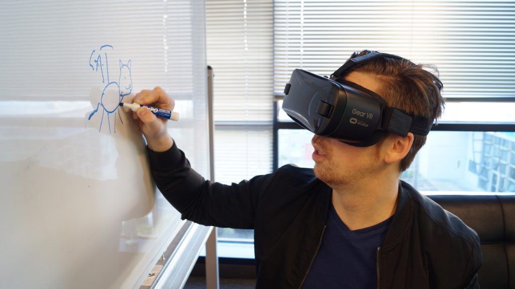 This picture show a person using a VR gear.