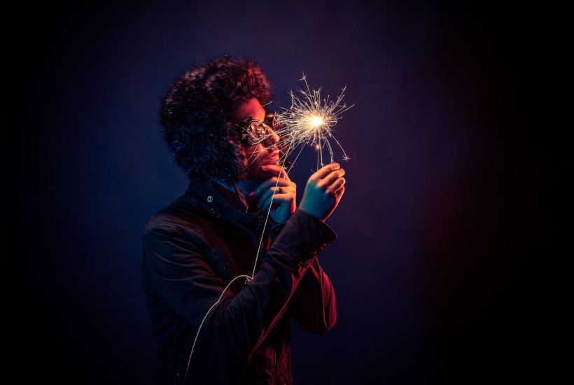 This picture show a guy holding a spark, representing innovation.