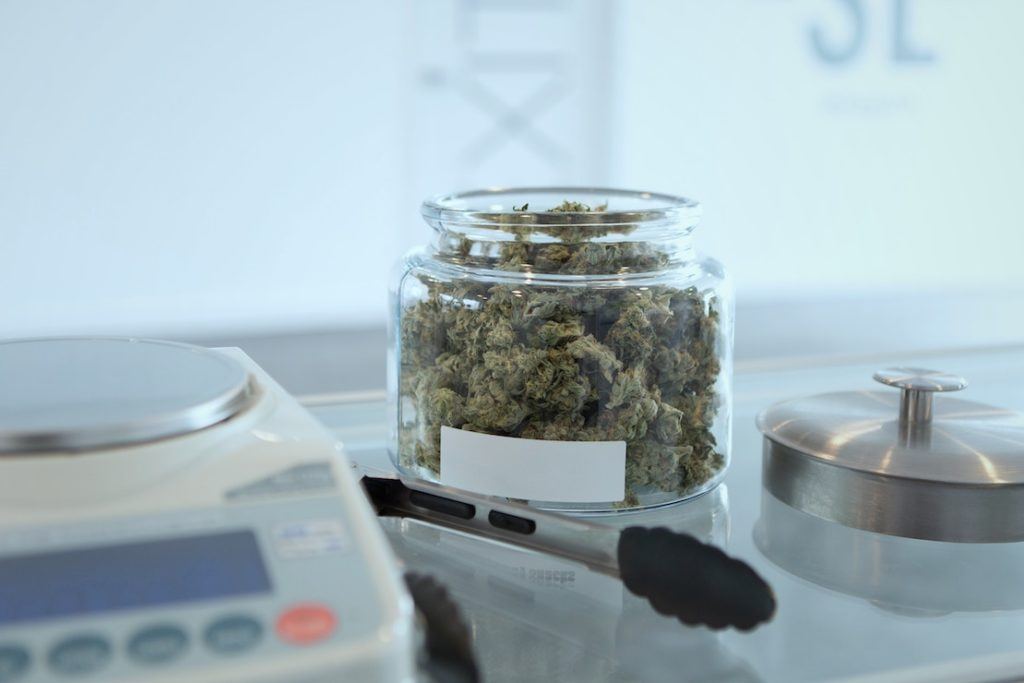 This picture show a cannabis product on top of a glass counter.