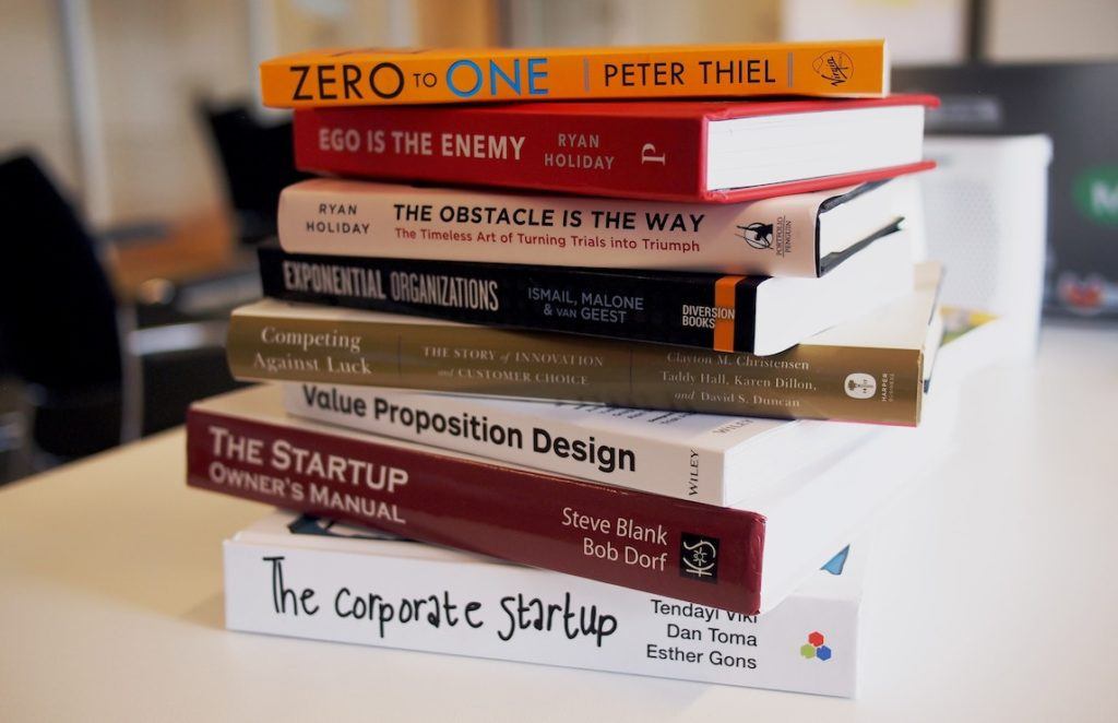 This picture show a pile of entrepreneur books.