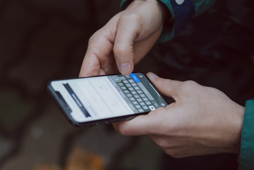 This picture show a person using a smartphone.