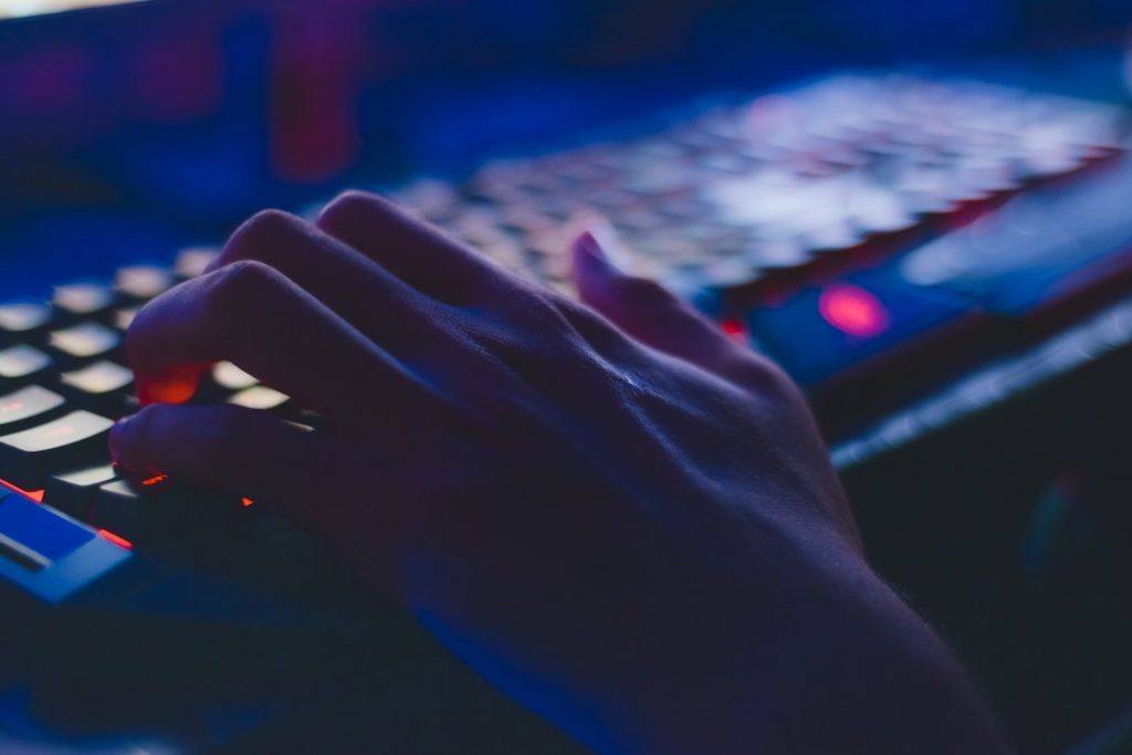 This picture show a person typing on a keyboard, loosely related to fintech.