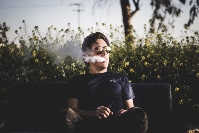 This picture show a guy vaping cannabis.