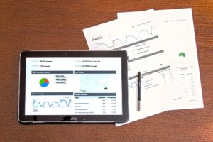 This picture show a tablet with some investment data.