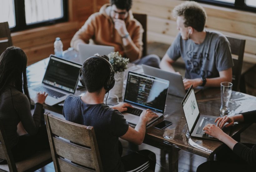 This picture show a group of people having a meeting.