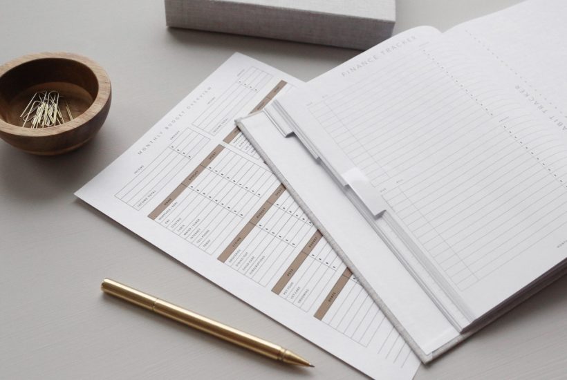 This picture shows some papers on a desk.