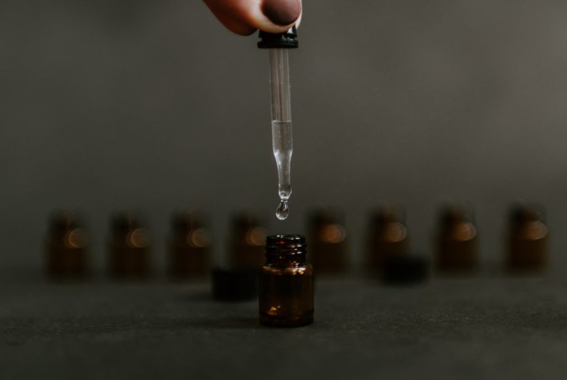 This picture show a medicine being put on a bottle.