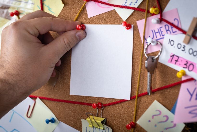 This picture show a blank paper being put on a board.