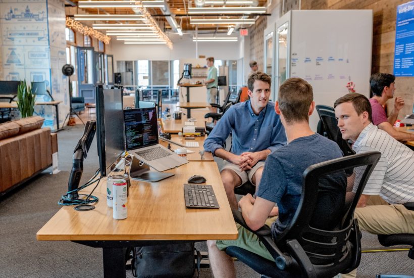 This picture shows a group of workers on an office.