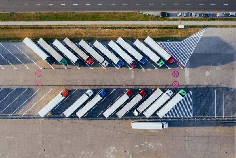 This picture show a couple of trucks parked.