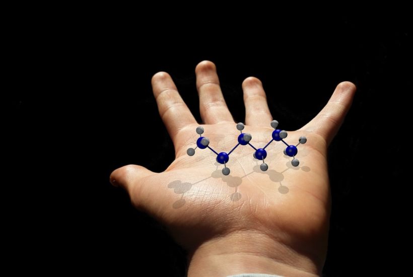 This picture show a person holding a molecule.