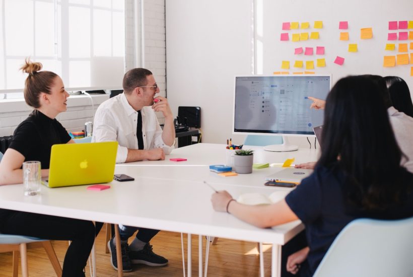 This picture shows a group of people in a meeting room.