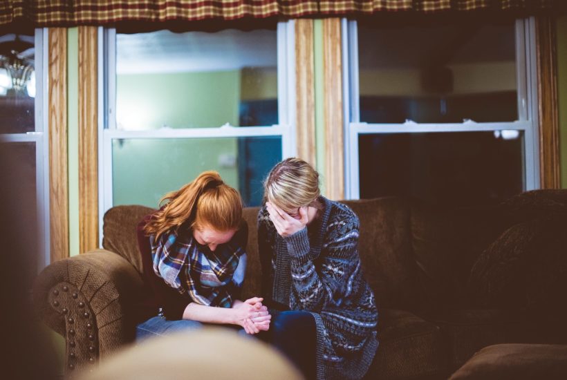 This picture show two women crying.