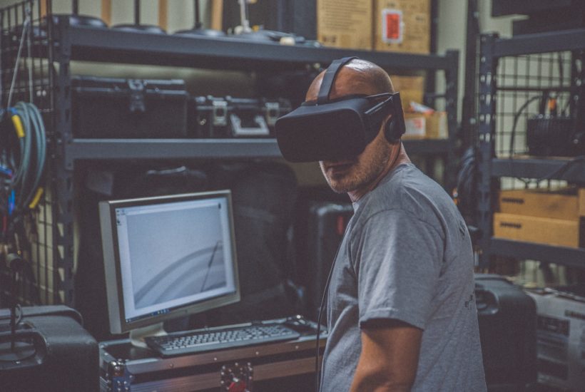 This picture show a man using a VR set.