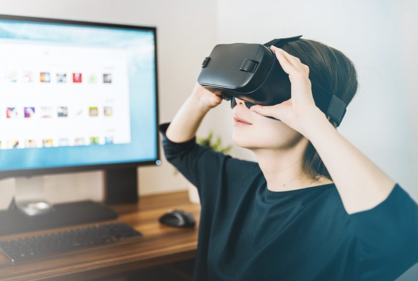 This picture show a person using a VR set.