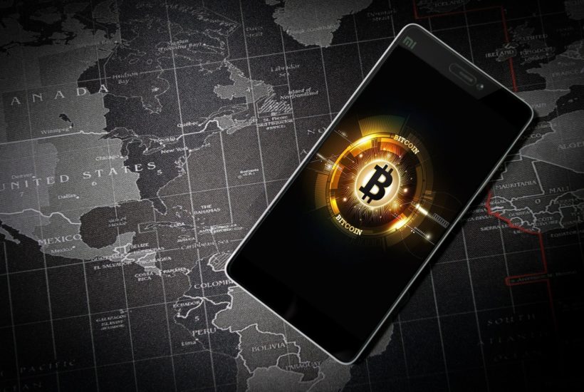 This picture show the bitcoin symbol on a smartphone.