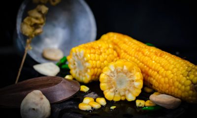 This picture show some corn on a table.