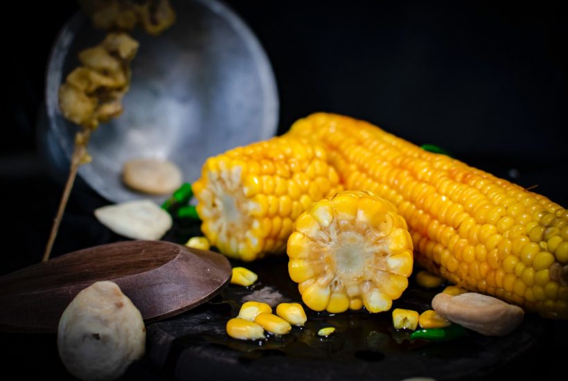 This picture show some corn on a table.