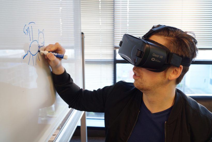 This picture show some writing on a board with a VR set.