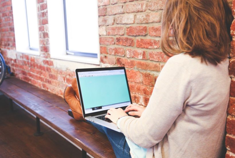 This picture show a woman doing marketing on her laptop.