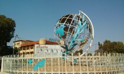 This picture show a globe monument.
