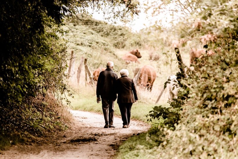 This picture show and old couple walking.