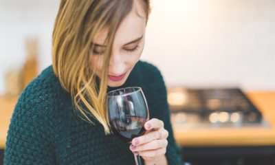 This picture show a woman drinking wine.