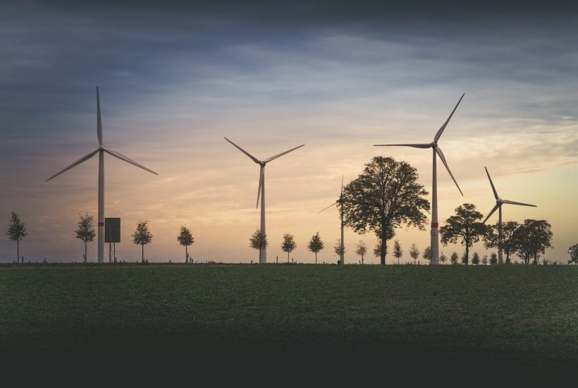 This picture show a couple of wind turbines.