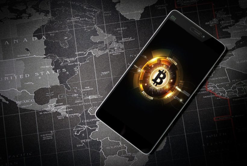 This picture show the bitcoin logo on a smartphone screen.