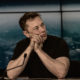Elon Musk contemplative, perhaps considering gold and silver curency?